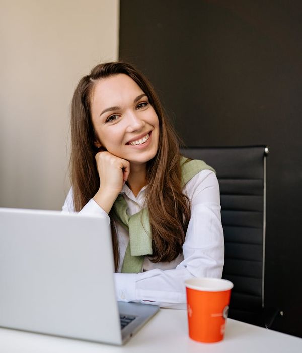 Woman feeling energetic and balanced in a bright, clean space.
